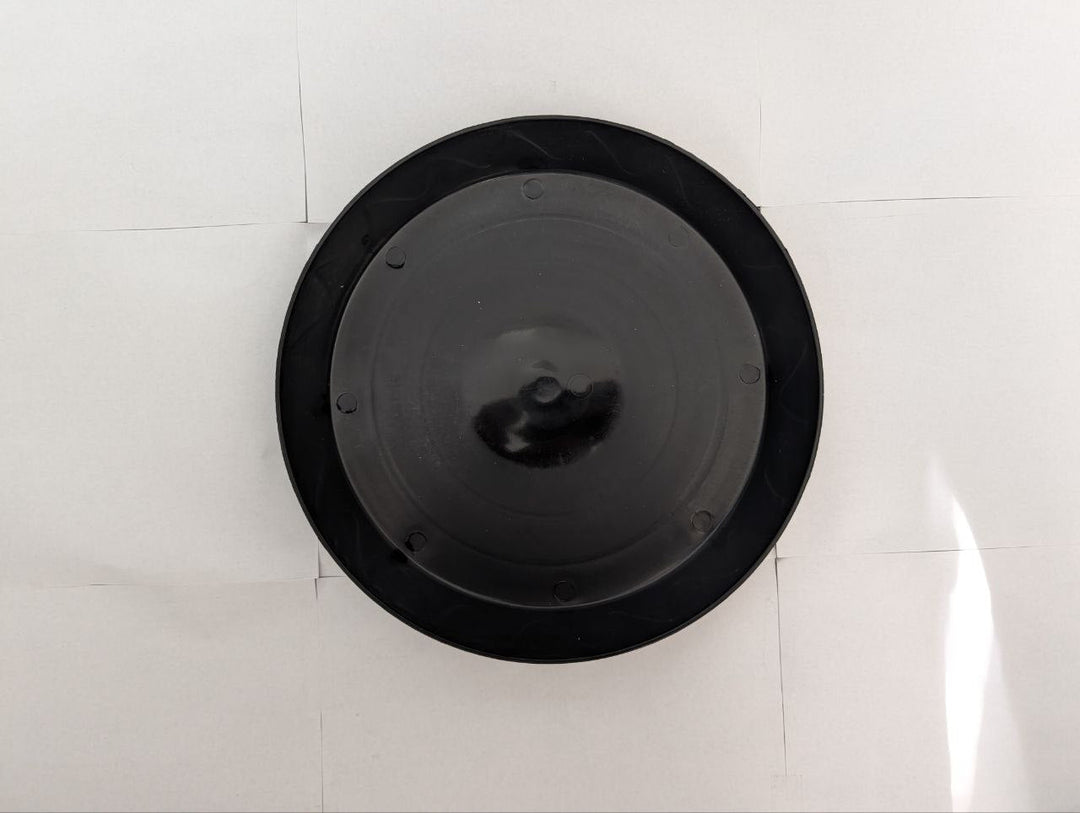 Top view of Green Oasis heavy-duty black plant saucer